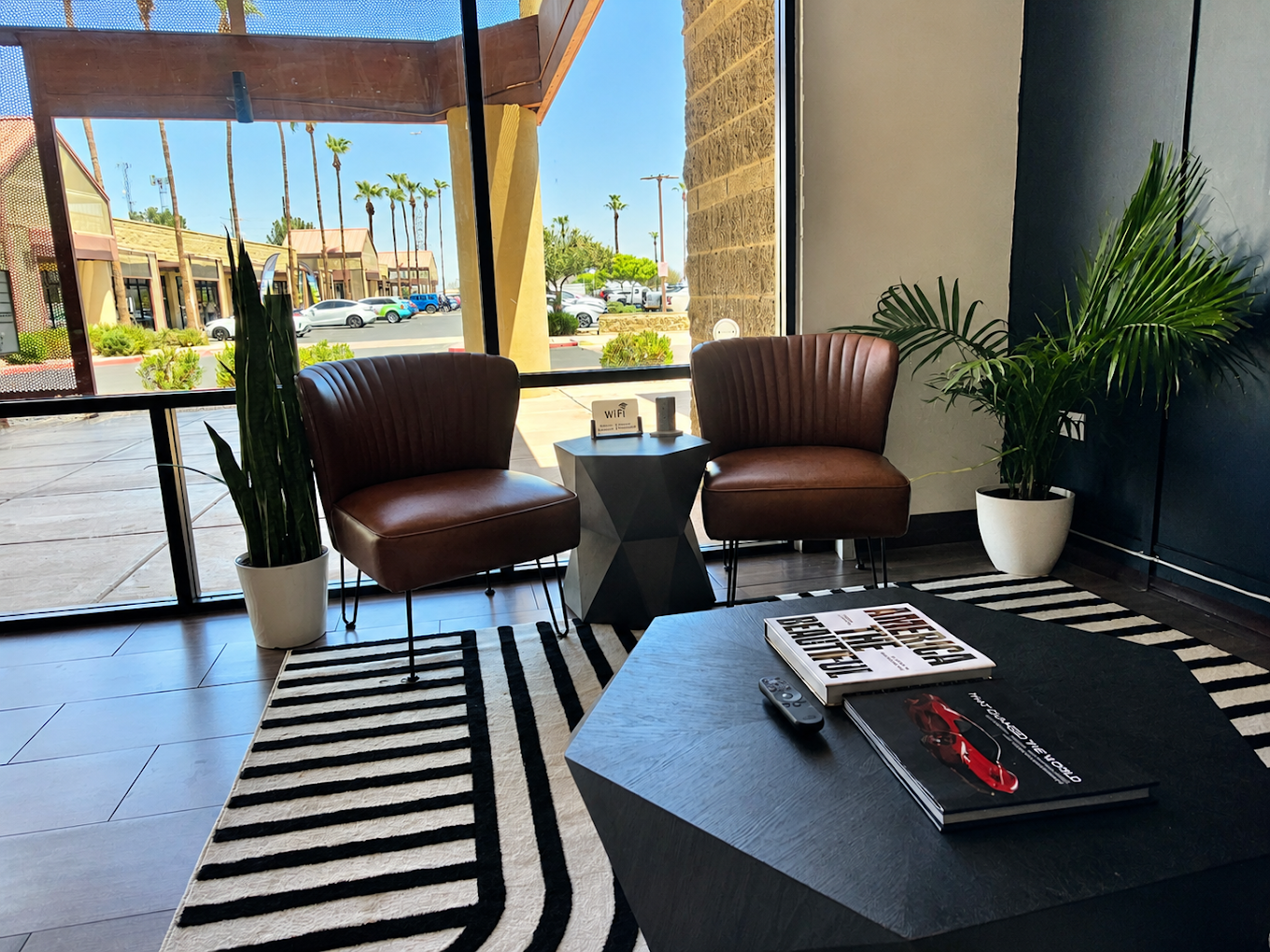 Leather lounge seating and a storefront view inside the ProView tint studio